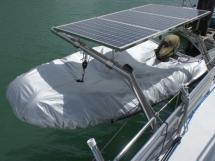 Tender on davits under solar panels