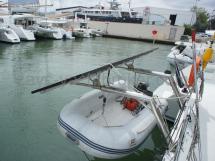 Tender on solar panels support davits